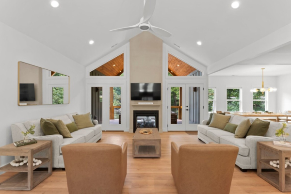 modern, warm great room with furniture and fireplace